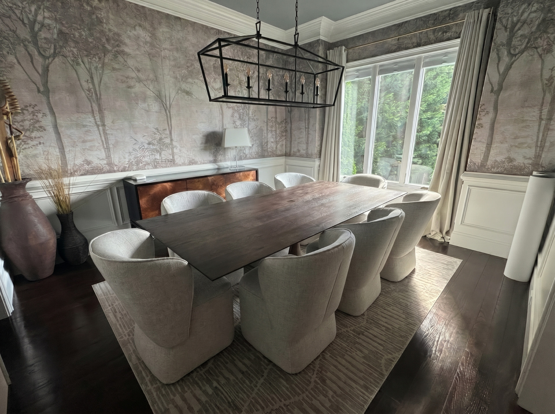 Muted forest mural wallpaper installed in a formal dining room in Asheville NC