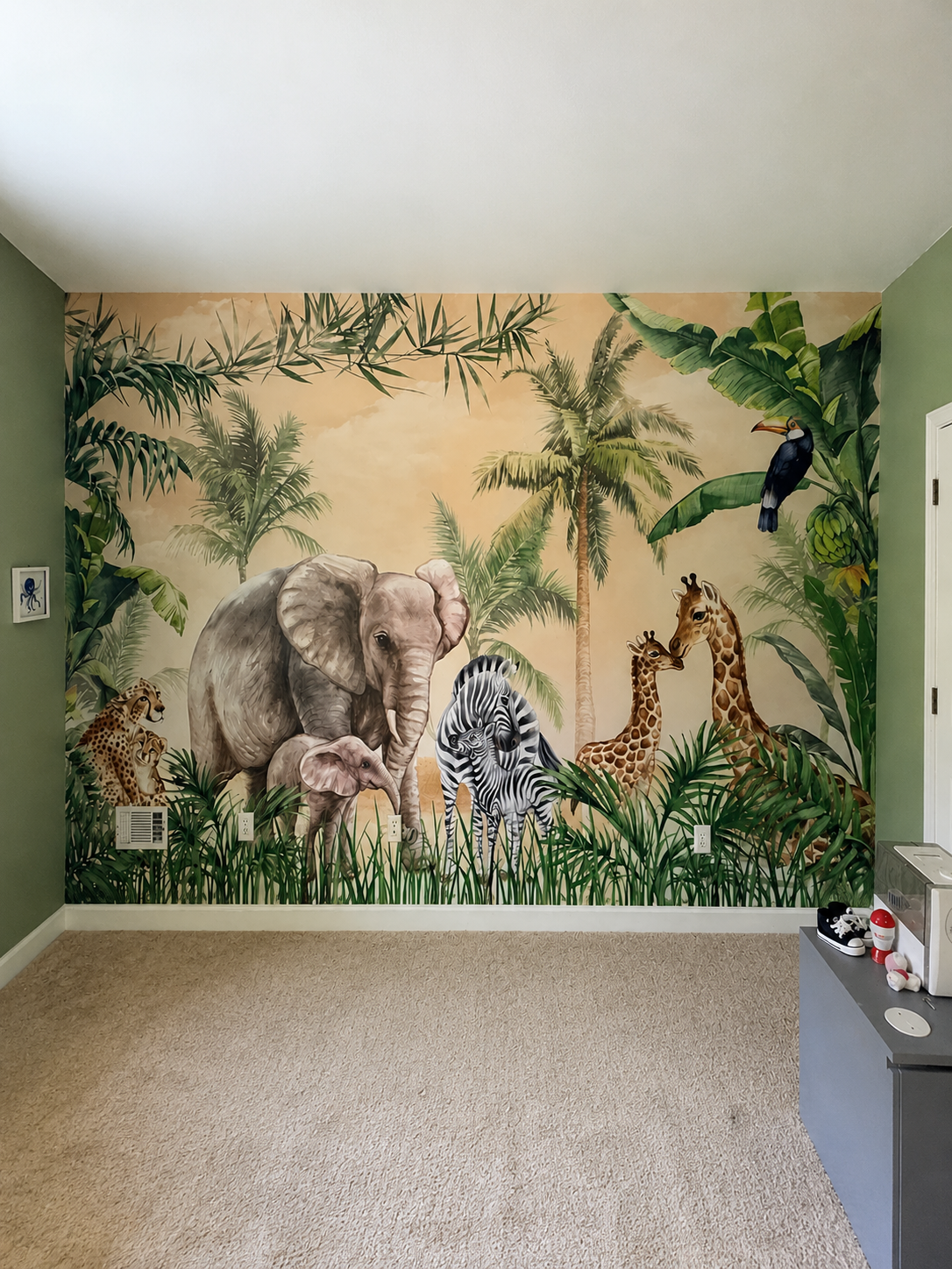 Jungle animals mural wallpaper installed in a child's bedroom in Asheville NC